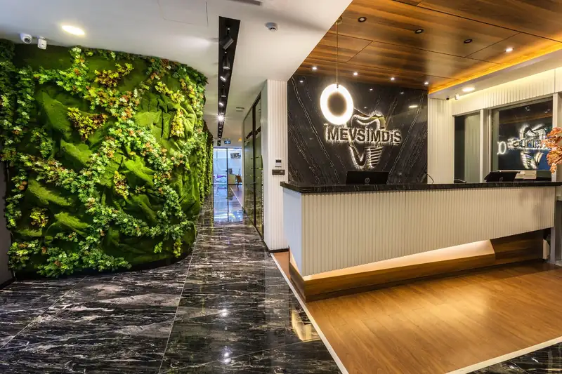 Reception of Mevsim Dental Clinic in Istanbul, with a living plant wall